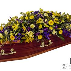 Cream, yellow and blue casket Spray